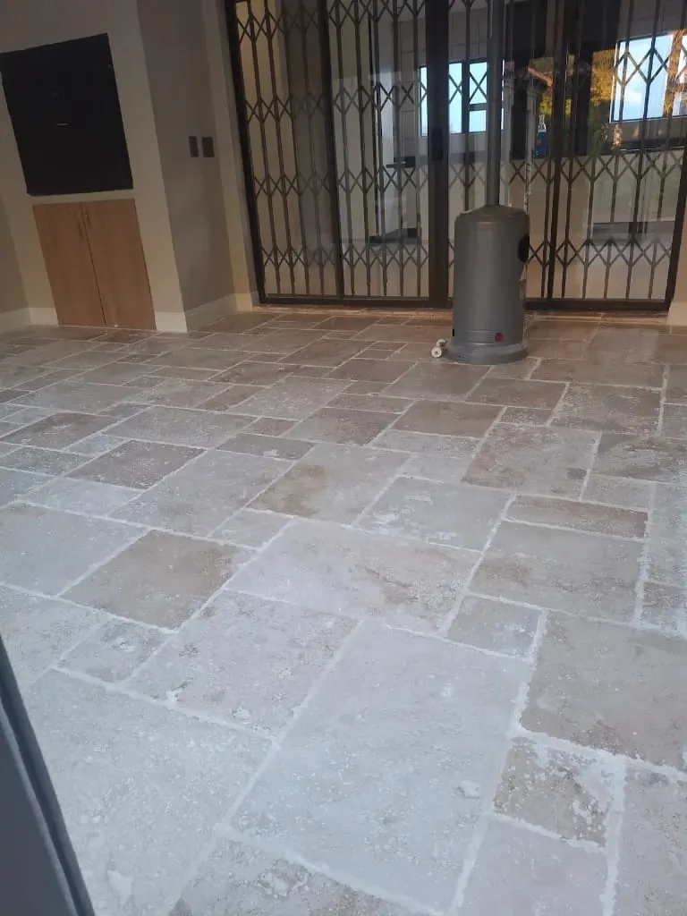 Natural stone tile floor in a patterned layout after cleaning